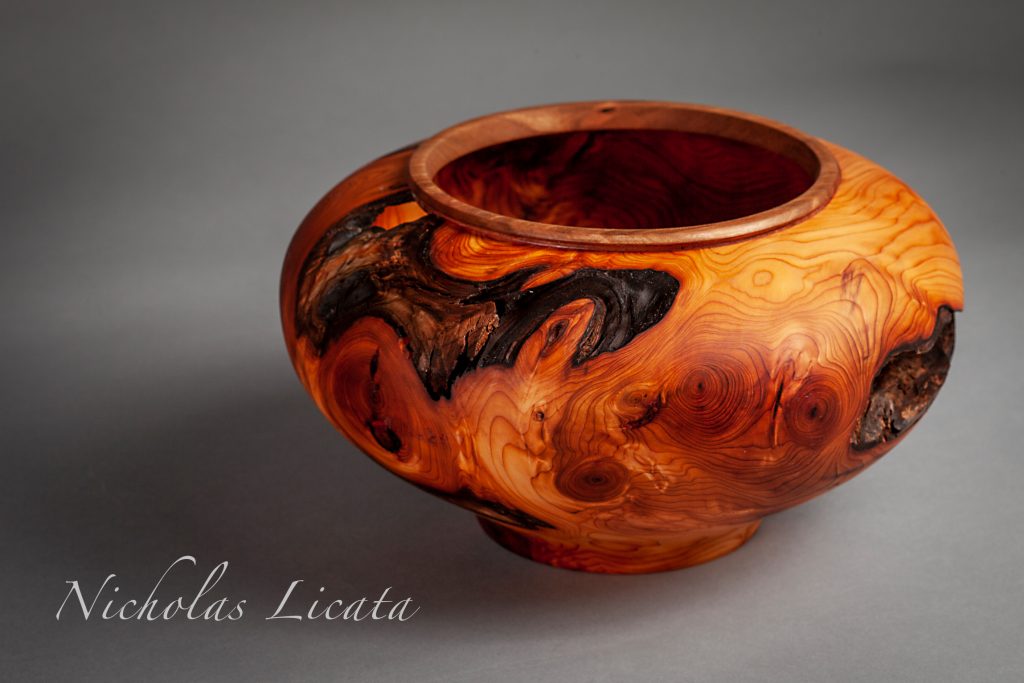 Turned hollow form bowl.  Lilac root burl sourced from Central Park in NYC